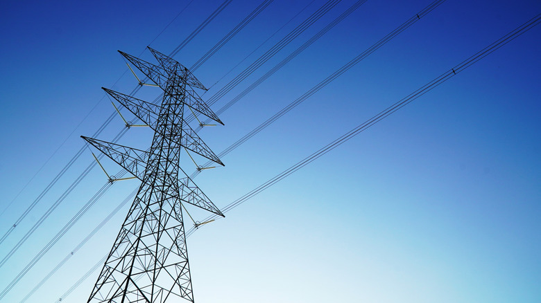 high voltage electricity pylon with blue sky