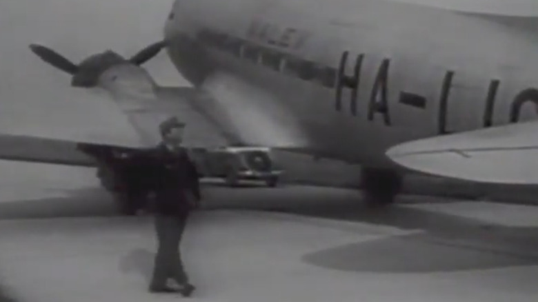 screenshot of plane from newsreel discussing hijacking