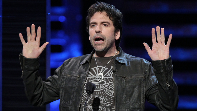 Greg Giraldo speaking on stage