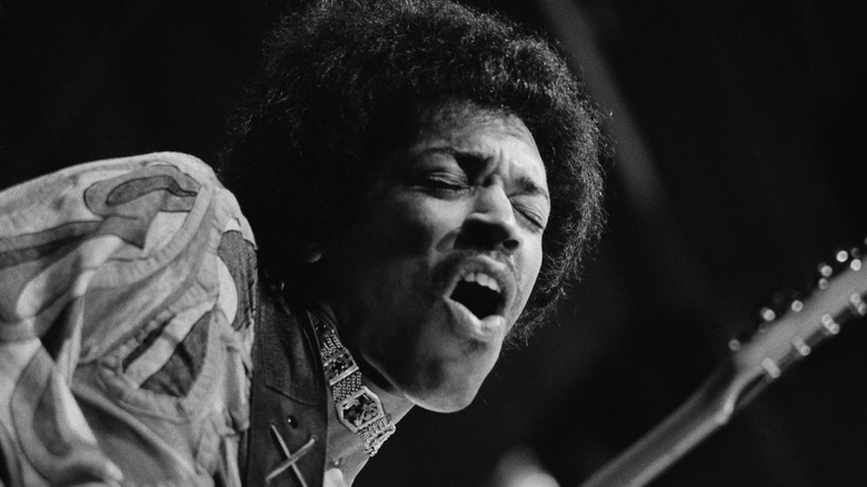 Jimi Hendrix performing on stage