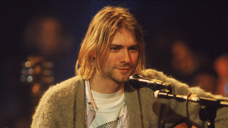 Kurt Cobain performing on stage