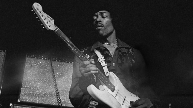 Jimi Hendrix playing guitar