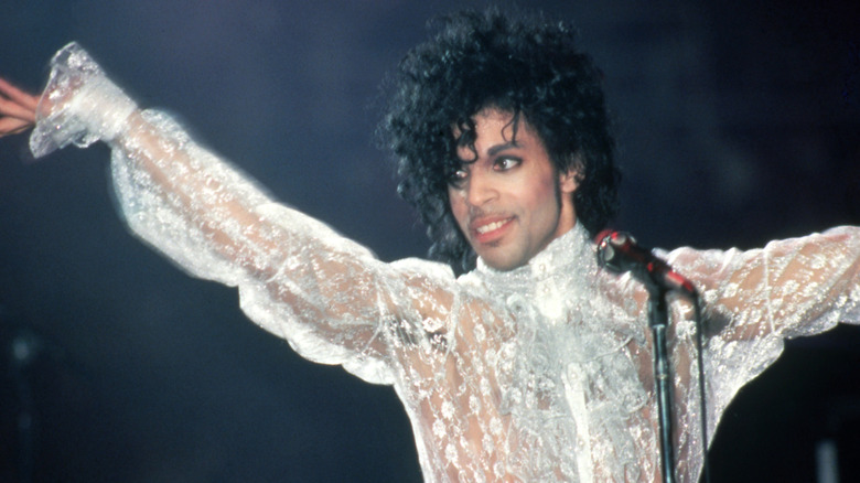 Prince performs onstage in 1984