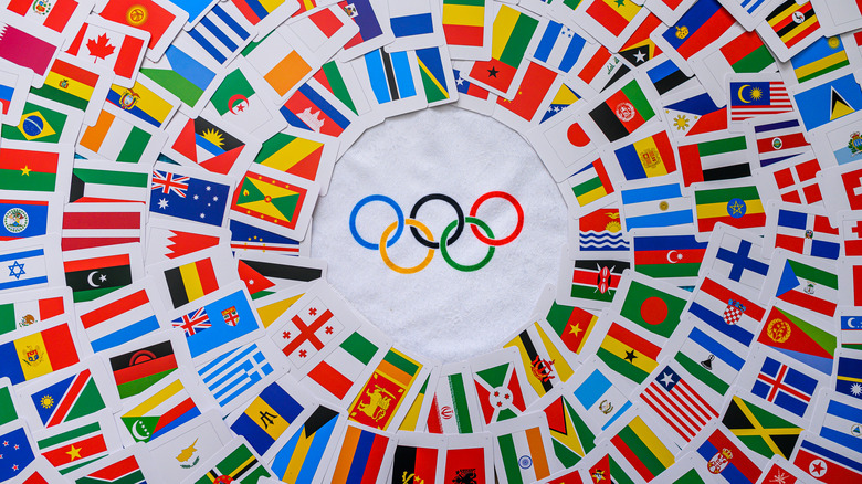 Olympic rings surrounded by world flags