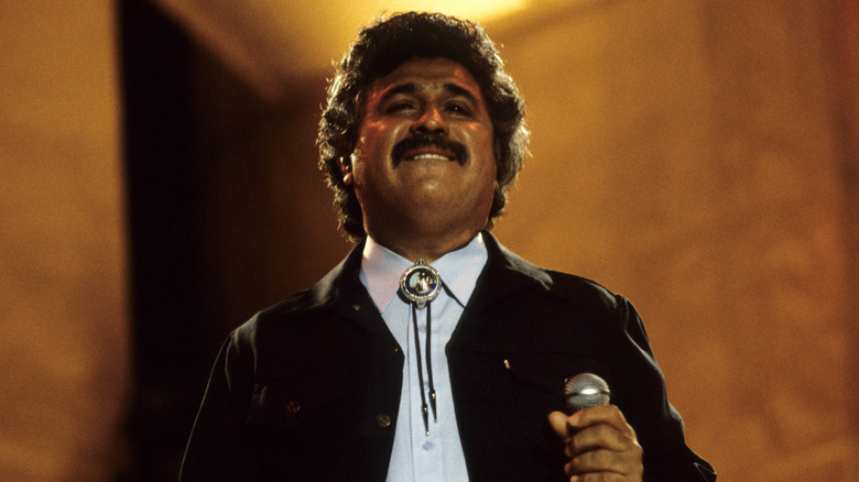 Freddy Fender biting his lip while performing