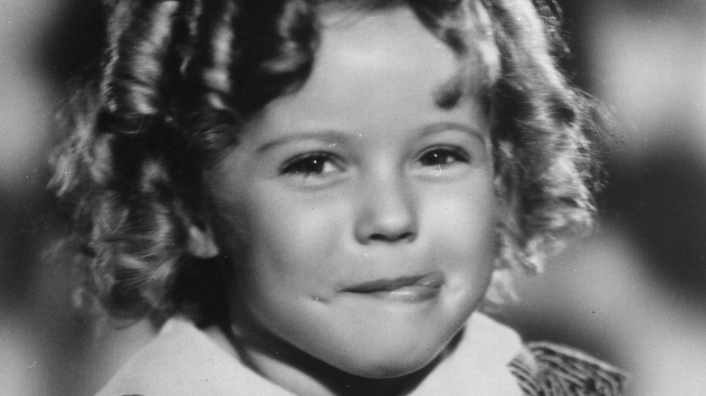 Shirley Temple sticking her tongue out