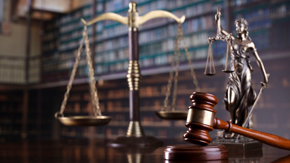 Judge's gavel on library background