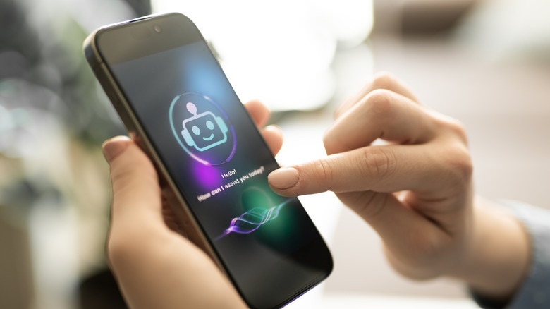 Female hand using AI chat bot on smartphone