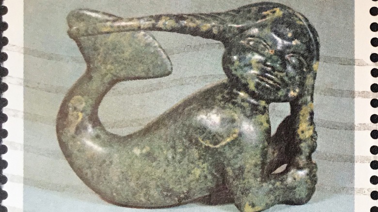 statue of sea goddess Sedna on stamp
