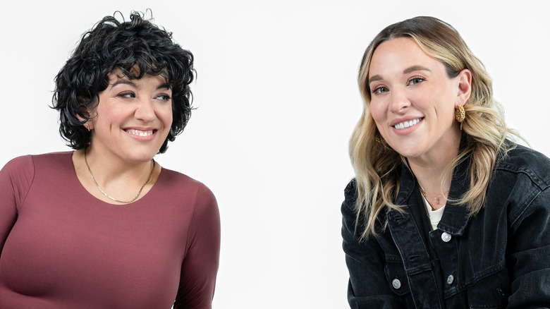 Brit Prawat and Ashley Flowers of Crime Junkie podcast smiling