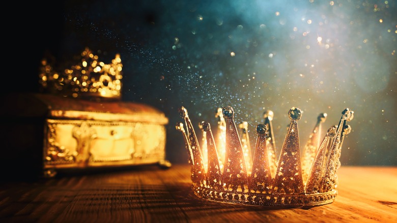 Crown on table blue background