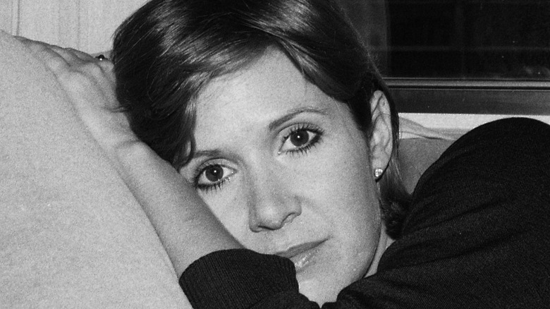 Carrie Fisher on couch
