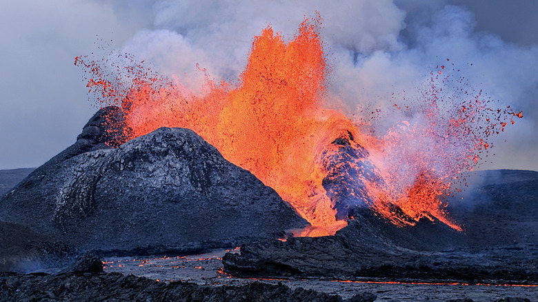 erupting volcano smoke clouds