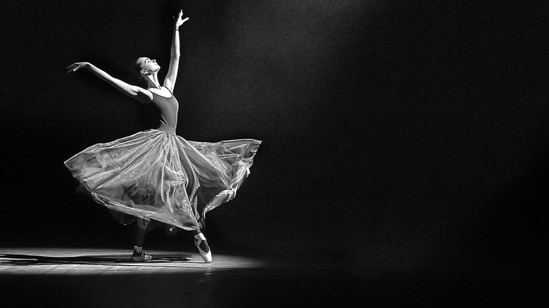 dancer with arms lifted