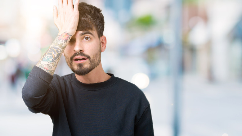 tattooed man who thinks he made a mistake