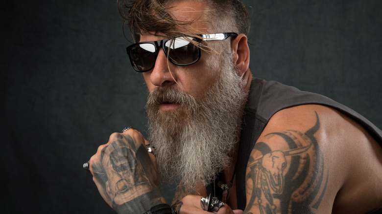 biker with several arm tattoos