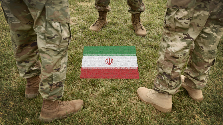 Iranian Revolutionary Guards around flag