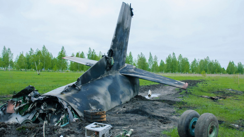 Plane crash wreckage in field