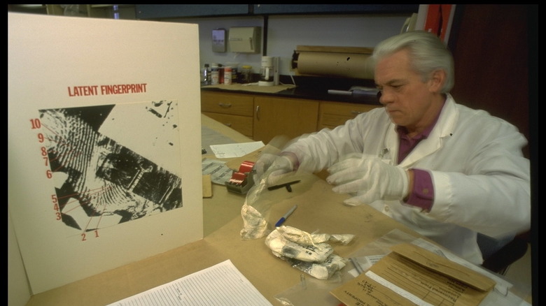 lab tech analyzing fingerprints