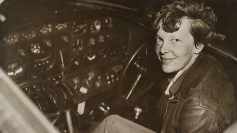 Amelia Earhart siting in cockpit 