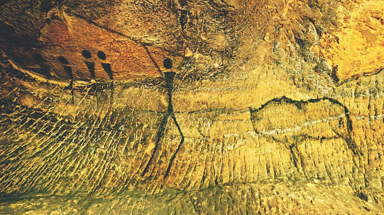 Illustration of early human with spear