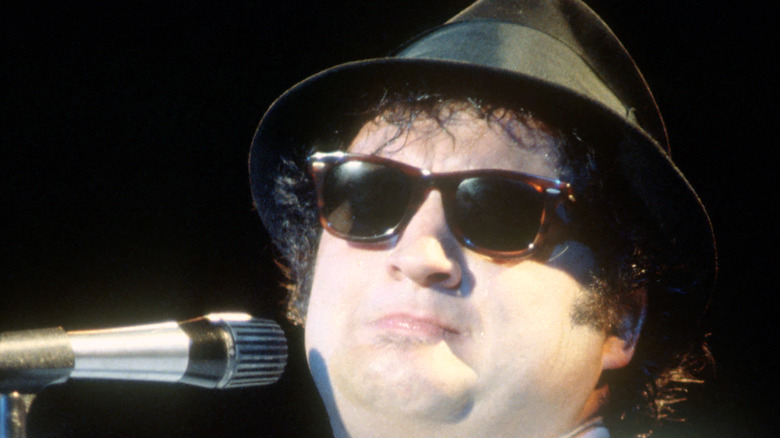 John Belushi performing onstage