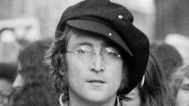 John Lennon posing
