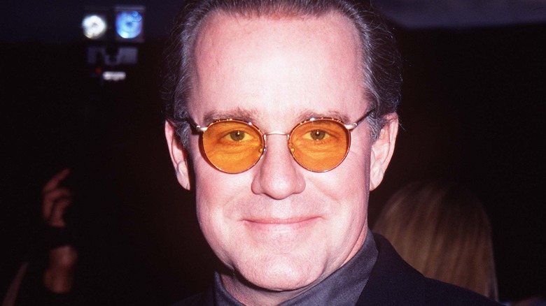 Phil Hartman in orange glasses