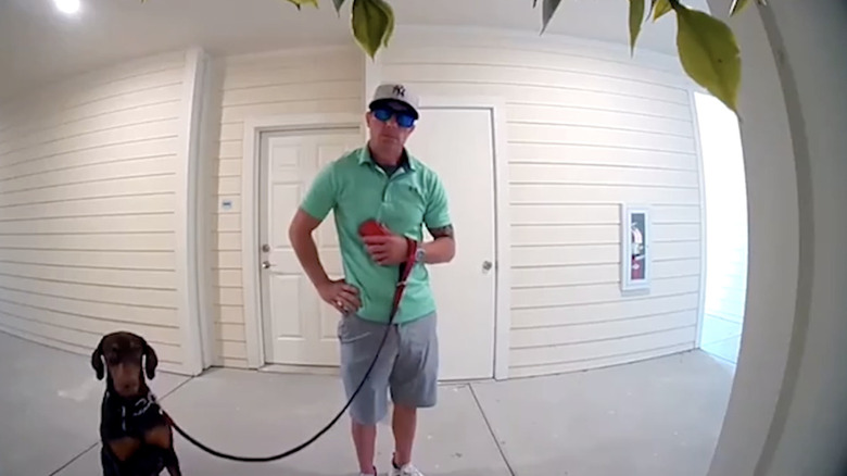 Man and dog on doorbell camera