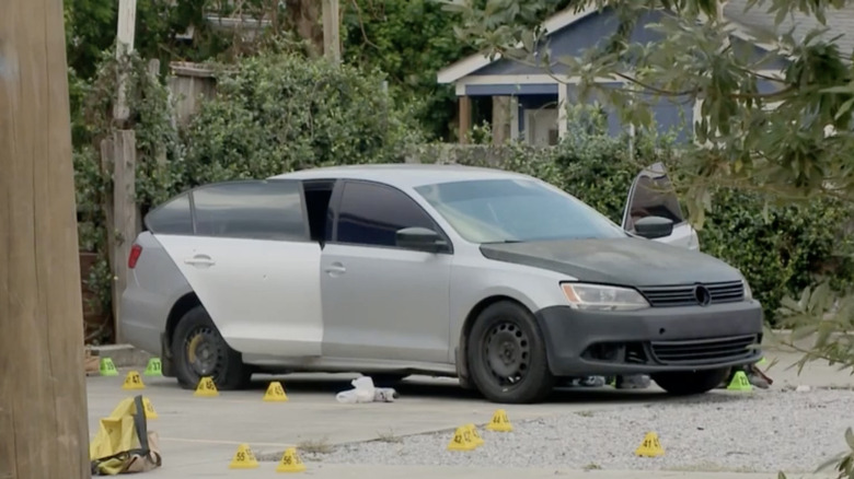 Car with doors open crime scene