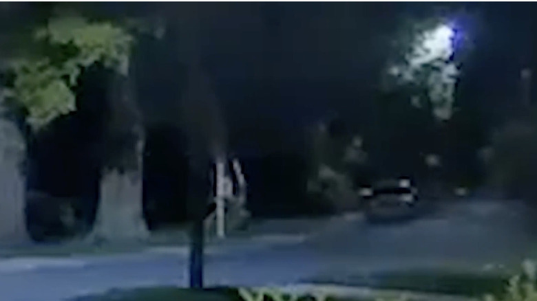 Blurry photo of car on street at night