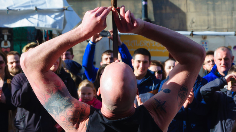 Sword swallower in action 