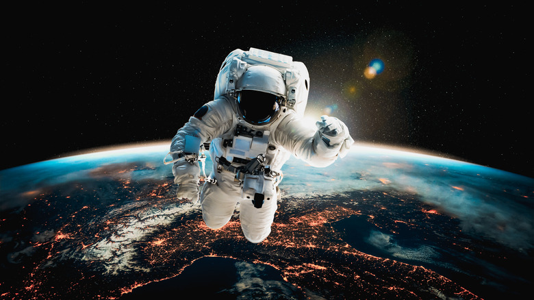 Astronaut on a spacewalk above Earth