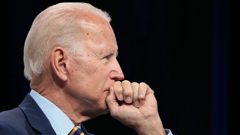 Biden fist over mouth