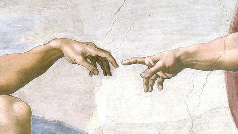 Michelangelo's God reaching for Adam