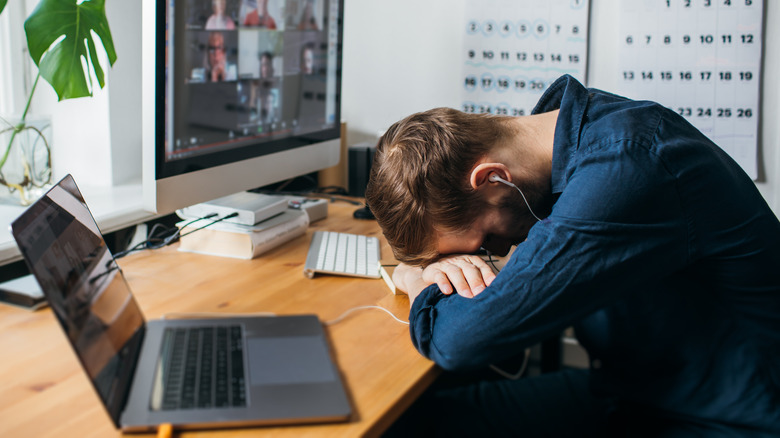 Person exhausted at their desk