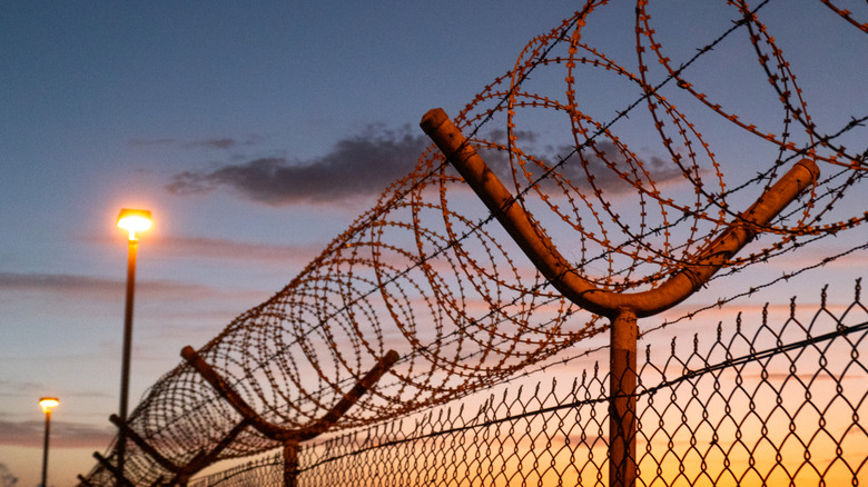 razor and barbed wire around prison