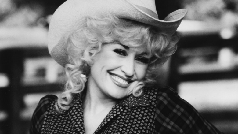 Dolly Parton smiling cowboy hat
