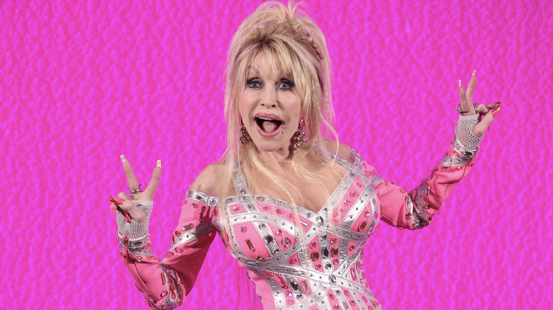 Dolly Parton pink dress pink background