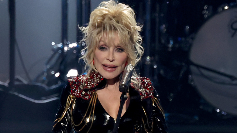 Dolly Parton playing guitar