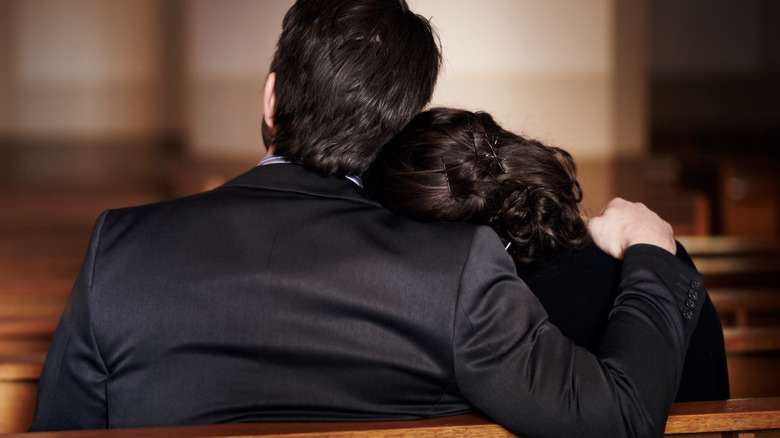 Grieving couple at funeral