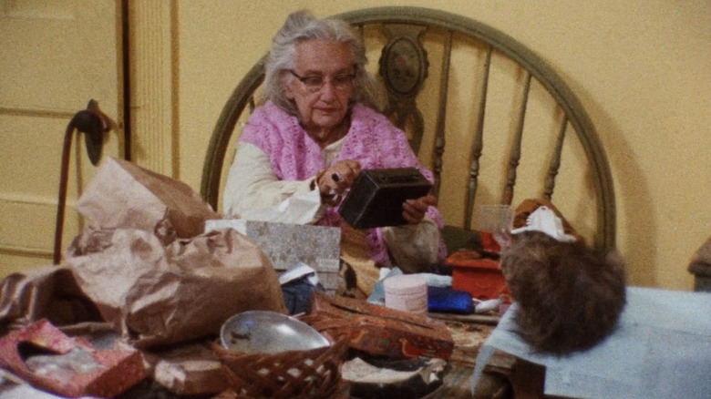  Edith Ewing Bouvier Beale sitting in bed surrounded by junk