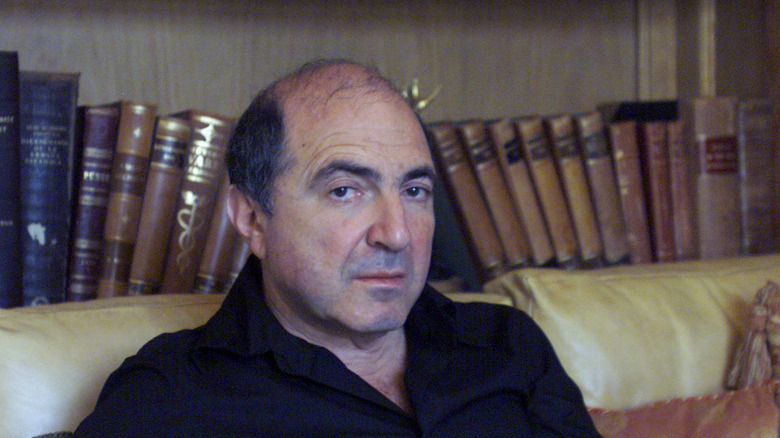 Boris Berezovsky sat black shirt books in background
