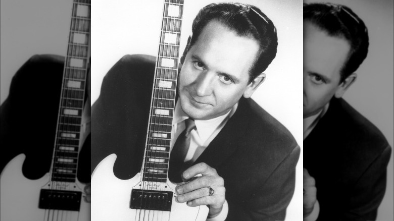 Les Paul posing with an SG
