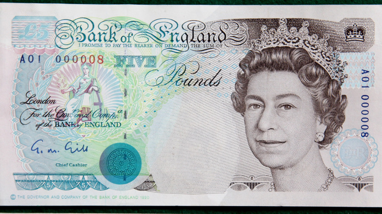 British five-pound note featuring Queen Elizabeth 