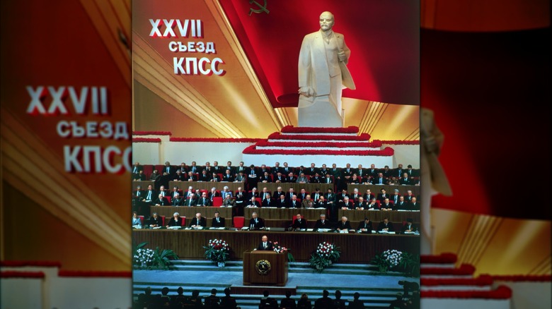 Soviet leader Mikhail Gorbachev addressing the 27th Party Congress in front of a huge statue of Lenin