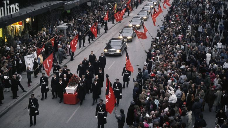 Crowds line the streets as the funeral procession of assassinated Swedish Prime Minister Olof Palme passes