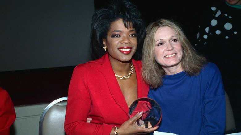 Oprah Winfrey accepting an award from Gloria Steinem's Ms. Magazine