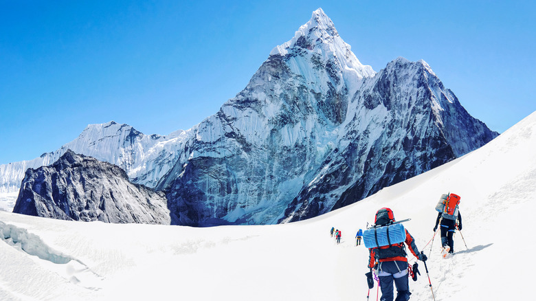 Mount Everest towers above approaching climbers