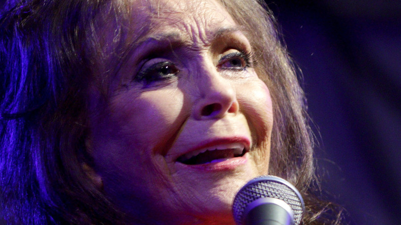 Loretta Lynn singing microphone